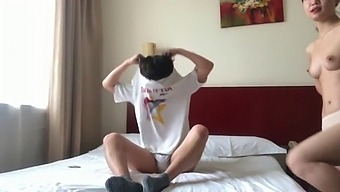 A Pair Of Chinese Lovers In A Hotel Suite